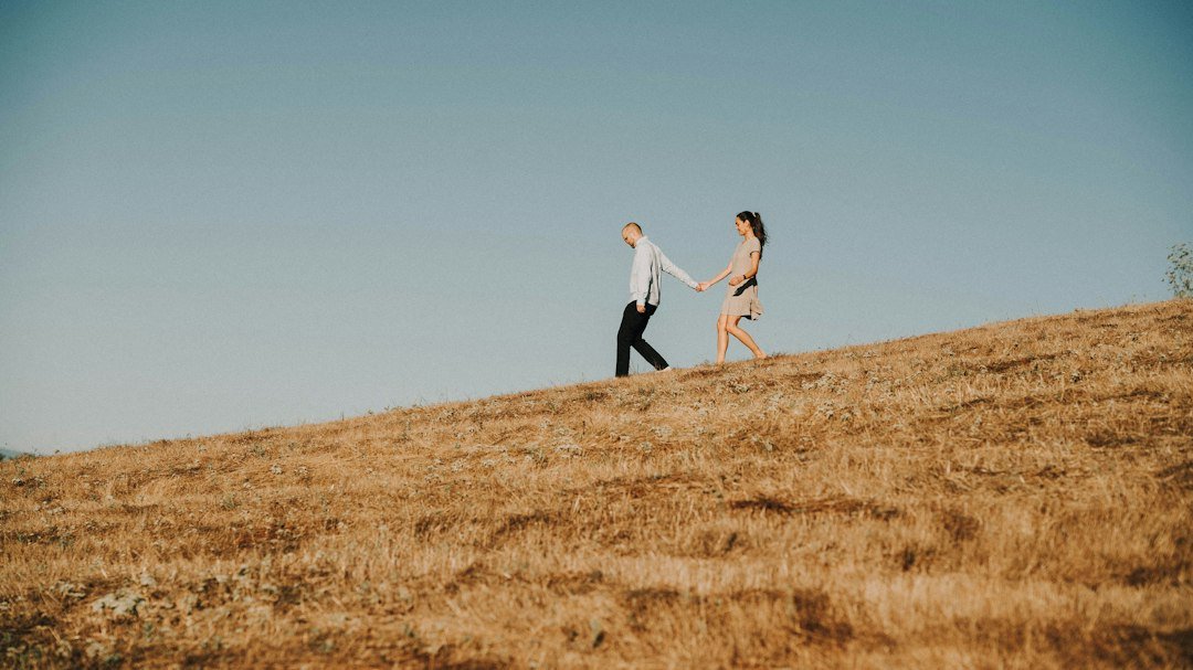 Couple walking through a field, representing Ruth and Boaz and godly relationships