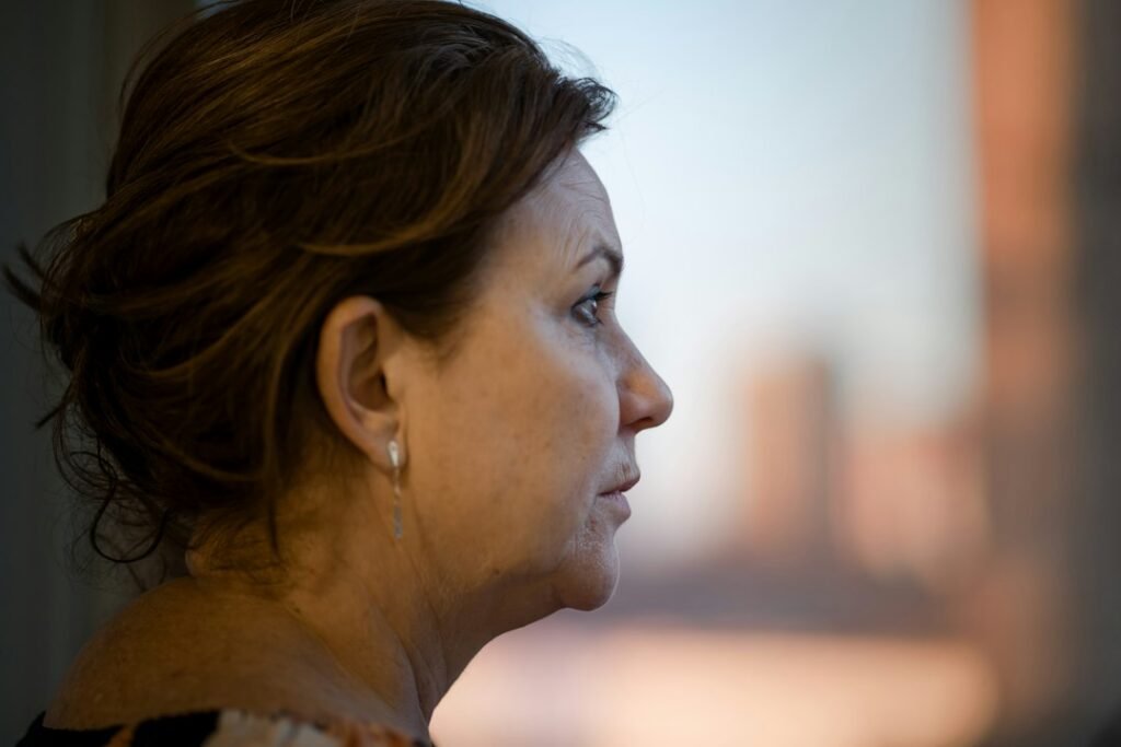 Thoughtful mature woman in natural light, representing Sarah in the Bible and waiting on God